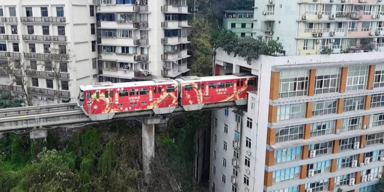 landscape-1490119692-light-railway-passes-through-residential-building-in-chongqing